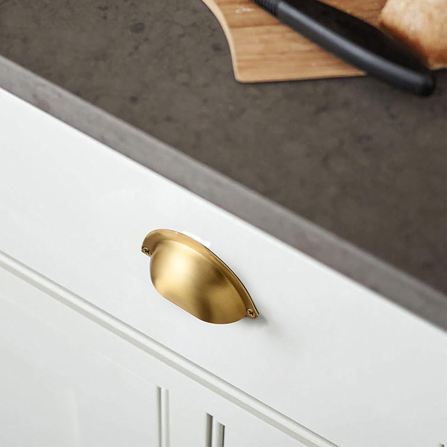 The Gold cup design brass knob fitting complements the white drawer background with its elegant and stylish appearance. The cup design adds a unique touch to the knob, creating a visually appealing focal point. The luxurious gold finish enhances its sophistication, making it an ideal choice for kitchen knobs, drawer knobs, and cabinet knobs. With its functional and decorative qualities, this brass knob effortlessly combines style and practicality.
