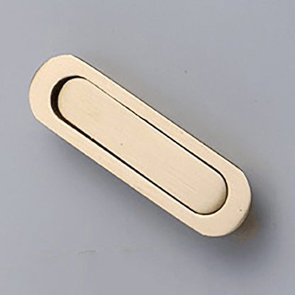 A sleek and stylish brass gold concealed handle is elegantly placed against a pristine white background. The concealed design adds a touch of sophistication to any cabinet or drawer, making it a discreet yet functional addition to your furniture.  The gleaming brass gold finish adds a luxurious touch, exuding a sense of opulence and refinement. Against the clean white backdrop, the handle&